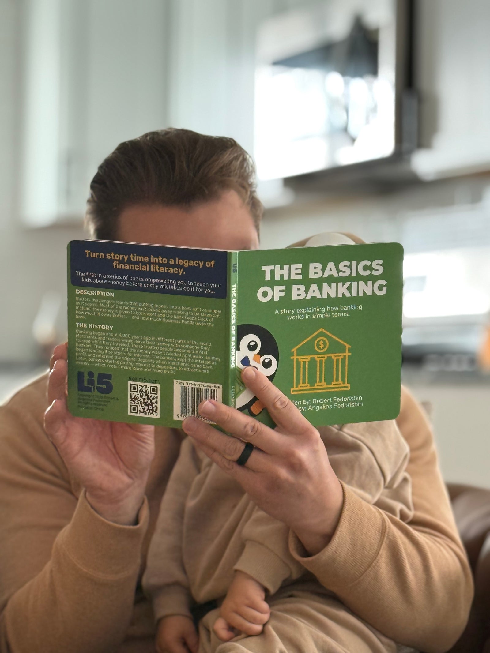 Person snuggling up with their child reading a kids money book titled 'The Basics of Banking'. Image shows that teaching kids about money doesn’t have to be a formal lesson.
